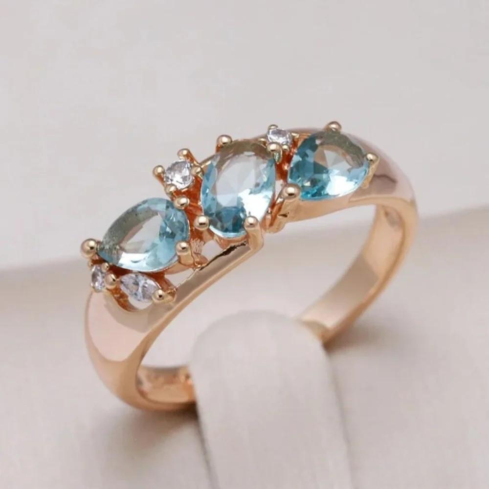 Gold ring with blue zirconia